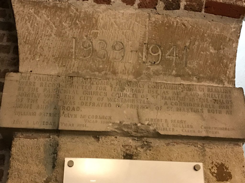 Marker memorializing the remains removed from the crypts below St. Martin of the Fields when it was converted to a bomb shelter. London, Dec. 2016.